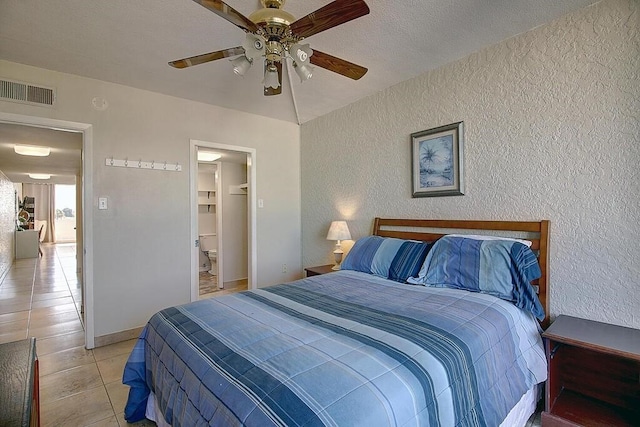 bedroom featuring ceiling fan and light tile patterned floors