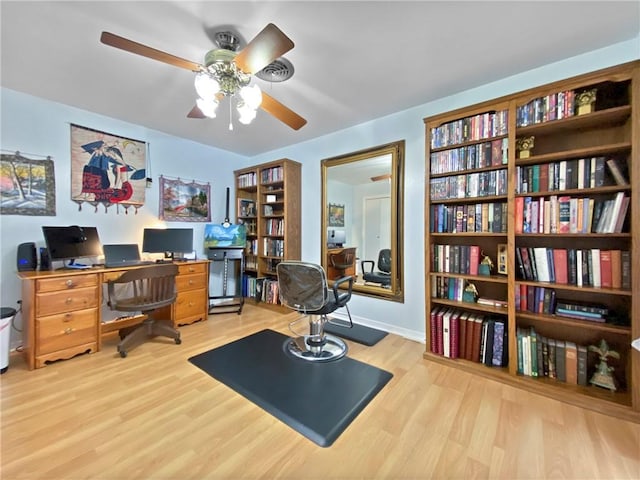 office space with ceiling fan and light hardwood / wood-style flooring