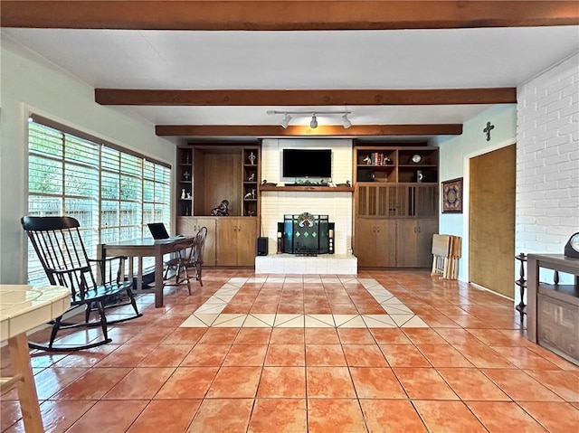 tiled living room with a fireplace and built in shelves