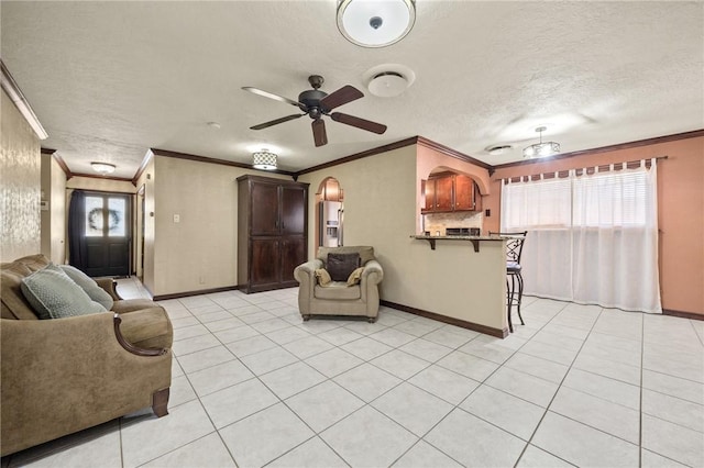 1317 Easthaven Dr, Corpus Christi, TX 78412 - living room with ornamental molding, baseboards, healthy amount of natural light, light tile patterned flooring, and a textured ceiling