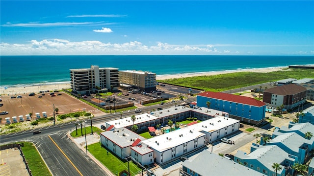 bird's eye view featuring a view of the beach and a water view