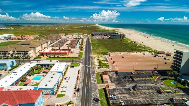 drone / aerial view featuring a view of the beach and a water view