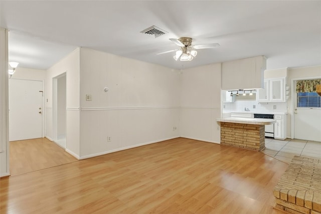 4634 Bonner Dr, Corpus Christi, TX 78411 - unfurnished living room with light wood-type flooring and a ceiling fan