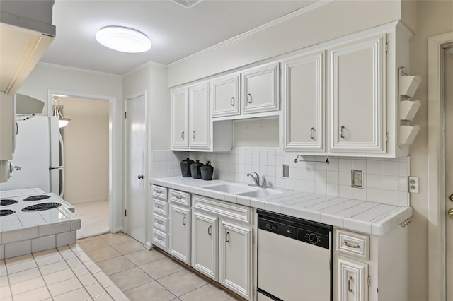 4634 Bonner Dr, Corpus Christi, TX 78411 - kitchen featuring white appliances, tile counters, backsplash, light tile patterned floors, and crown molding