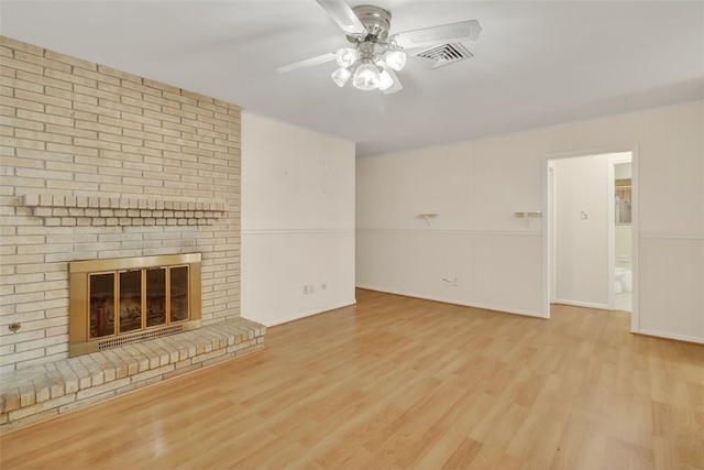 4634 Bonner Dr, Corpus Christi, TX 78411 - unfurnished living room featuring ceiling fan, wood finished floors, and a brick fireplace
