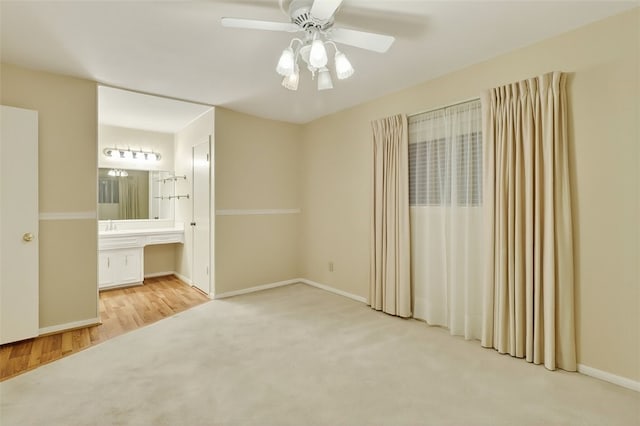 4634 Bonner Dr, Corpus Christi, TX 78411 - unfurnished bedroom featuring carpet floors, ensuite bathroom, and a ceiling fan