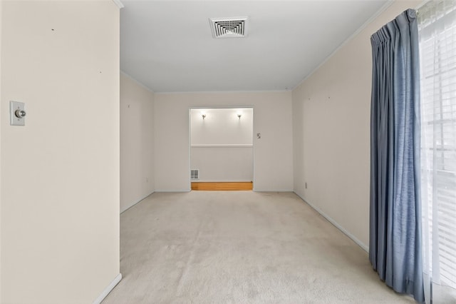 4634 Bonner Dr, Corpus Christi, TX 78411 - spare room with light colored carpet, ornamental molding, and healthy amount of natural light