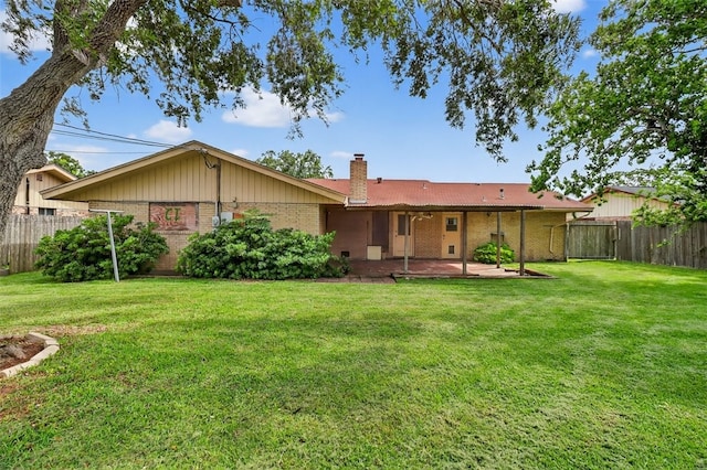 4634 Bonner Dr, Corpus Christi, TX 78411 - rear view of house with brick siding, a chimney, and a patio
