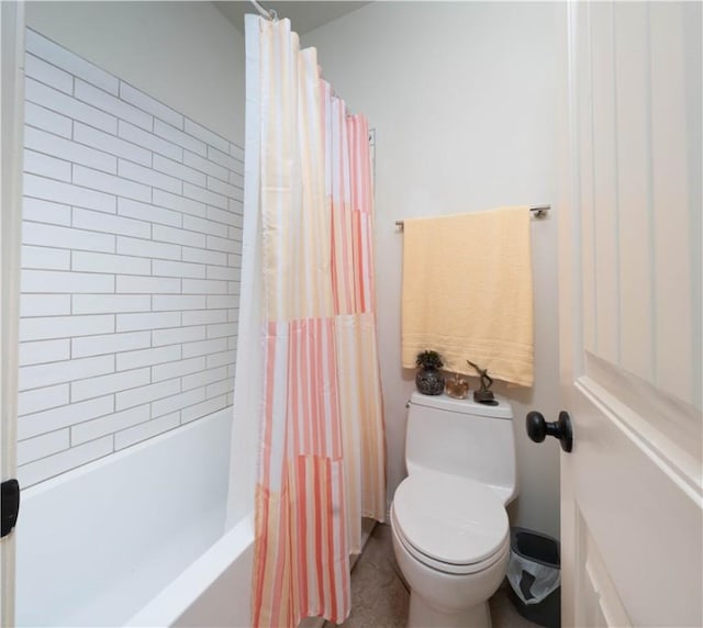 5806 Lago Vista Dr, Corpus Christi, TX 78414 - bathroom featuring toilet and shower / bath combination with curtain