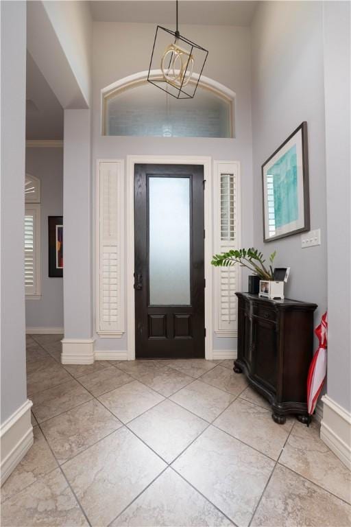 5806 Lago Vista Dr, Corpus Christi, TX 78414 - entryway with a towering ceiling, baseboards, plenty of natural light, and light tile patterned floors