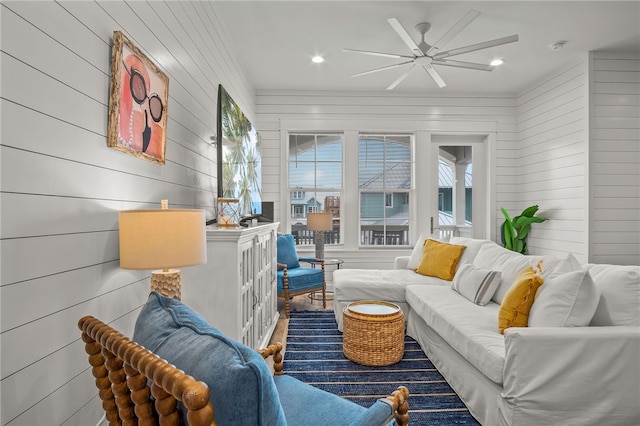 sunroom / solarium featuring ceiling fan