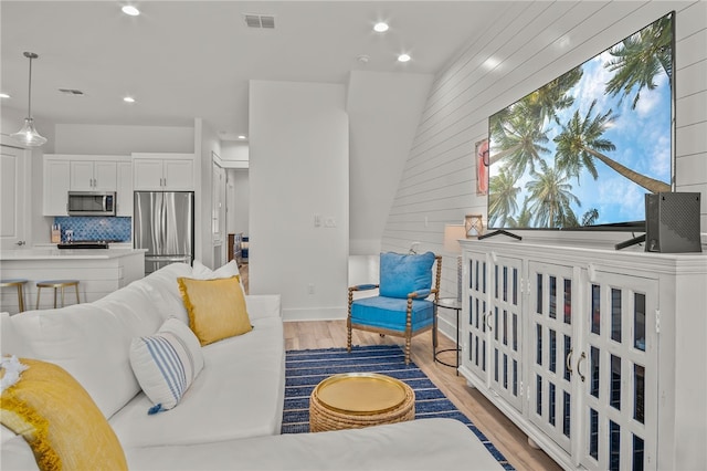 living room with light hardwood / wood-style floors