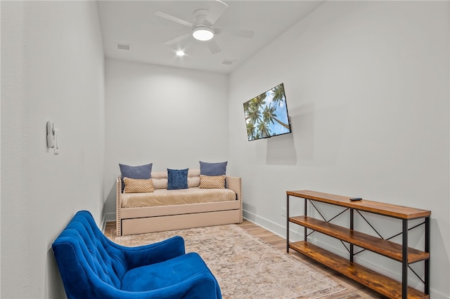 sitting room featuring hardwood / wood-style flooring and ceiling fan