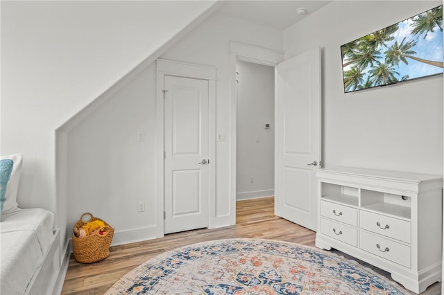 bedroom with light hardwood / wood-style floors