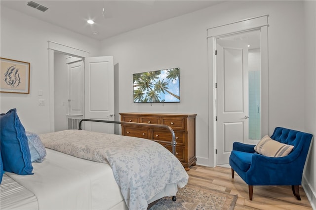 bedroom with light hardwood / wood-style flooring