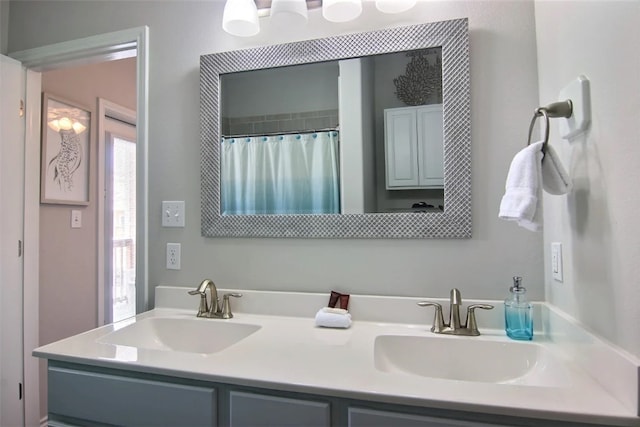 bathroom with vanity and curtained shower