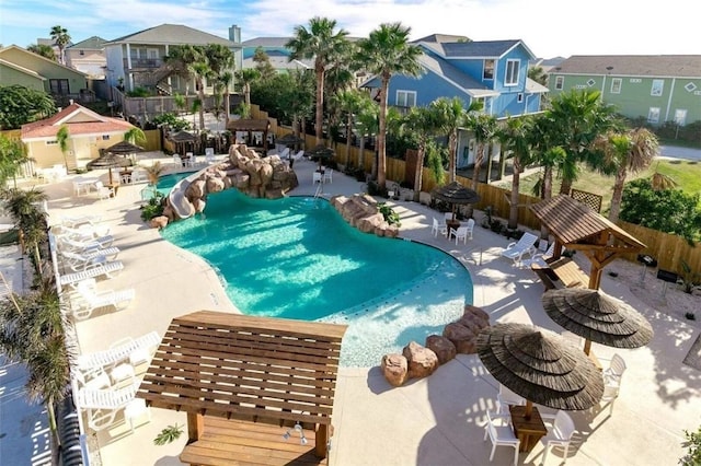 view of pool with a pergola and a patio area