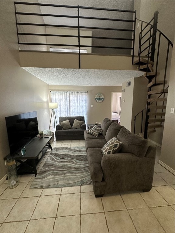 tiled living room with a textured ceiling