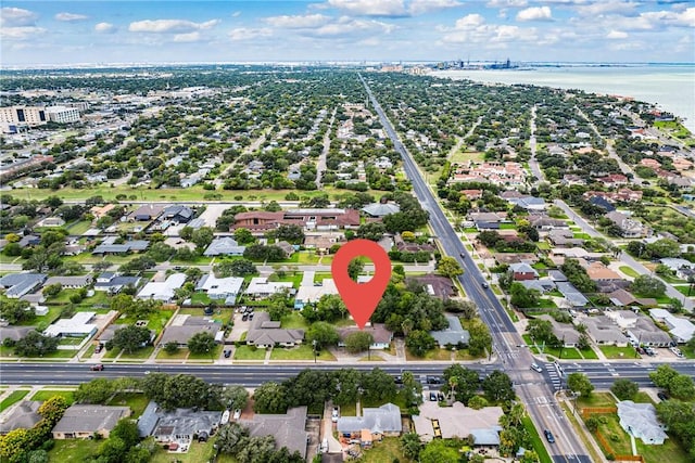 bird's eye view featuring a water view and a residential view