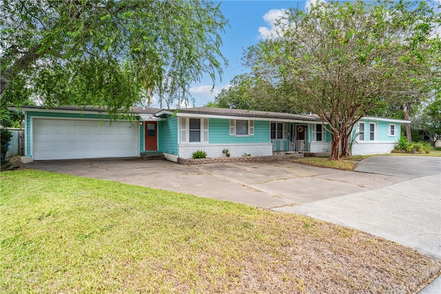 ranch-style house with a front yard and a garage