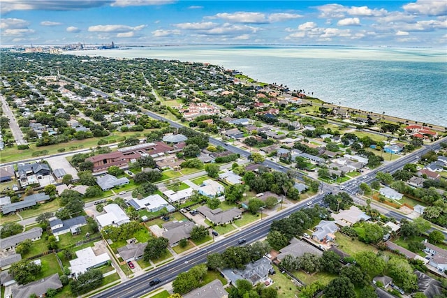 drone / aerial view featuring a water view and a residential view