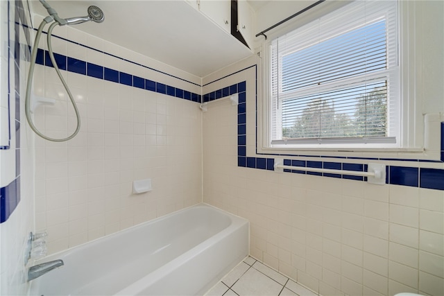 full bath with shower / bathtub combination, tile walls, and tile patterned floors