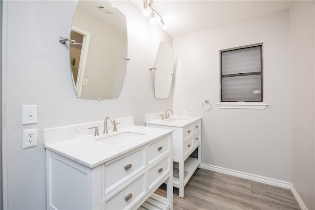 bathroom featuring vanity and wood-type flooring