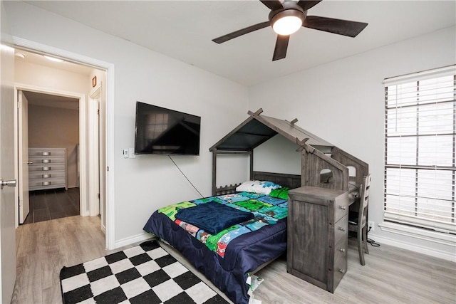 bedroom featuring ceiling fan and light hardwood / wood-style flooring