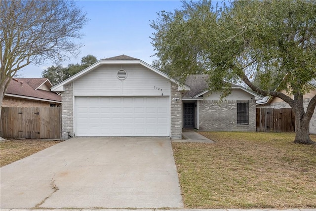 single story home with a garage and a front yard