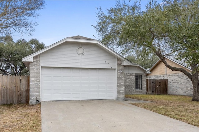 single story home featuring a garage and a front lawn