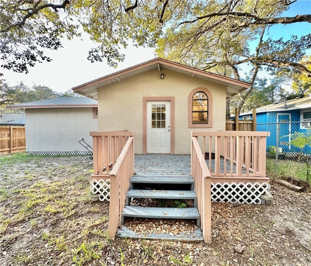 rear view of property with a deck