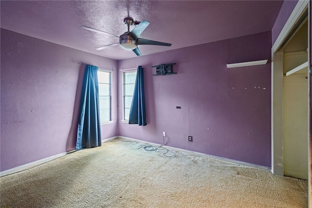 5725 Woodhaven Dr, Corpus Christi, TX 78412 - spare room featuring ceiling fan, carpet floors, a textured wall, and a textured ceiling
