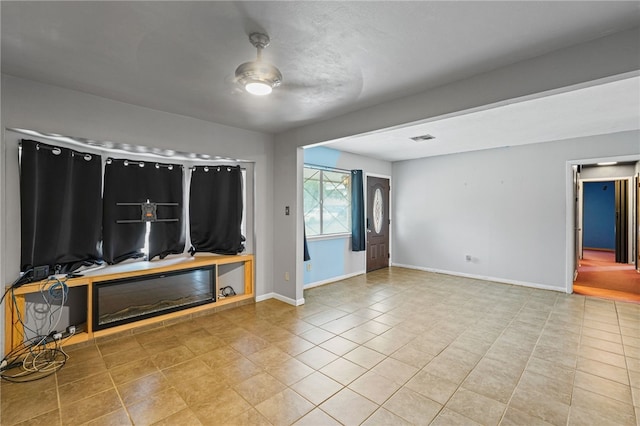 5725 Woodhaven Dr, Corpus Christi, TX 78412 - unfurnished living room with tile patterned flooring and baseboards