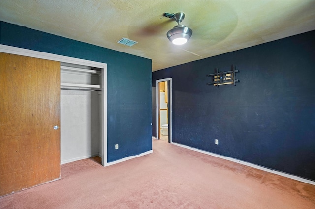 5725 Woodhaven Dr, Corpus Christi, TX 78412 - unfurnished bedroom with carpet, a closet, and ceiling fan