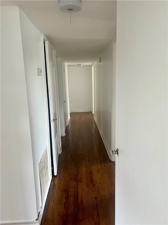 hall with dark hardwood / wood-style floors