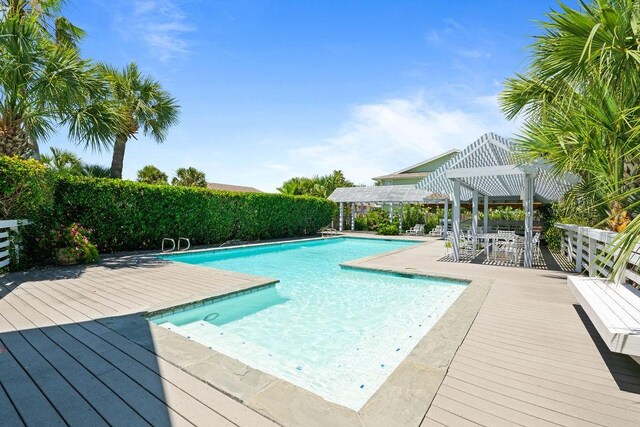 13 Sandpiper Ln, Rockport, TX 78382 - view of pool with a pergola and a wooden deck