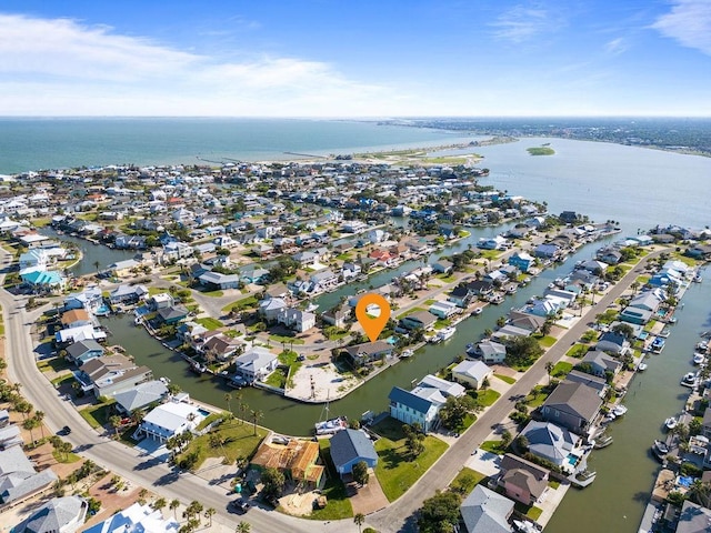 13 Sandpiper Ln, Rockport, TX 78382 - aerial view of property and surrounding area featuring a large body of water and nearby suburban area
