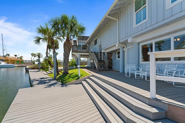 13 Sandpiper Ln, Rockport, TX 78382 - wooden terrace with a dock and a water view