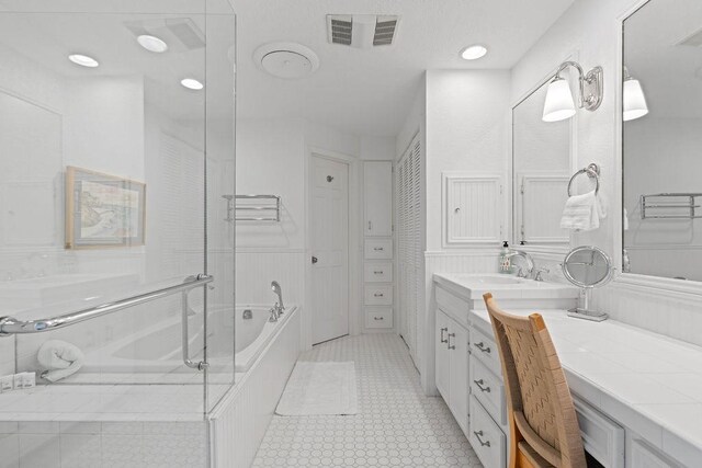 13 Sandpiper Ln, Rockport, TX 78382 - bathroom featuring a bath, vanity, and recessed lighting