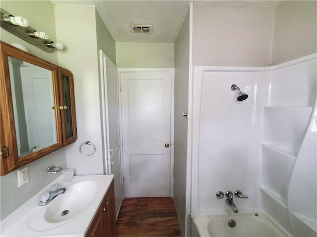 4413 N Cornelia Cir, Corpus Christi, TX 78408 - full bath featuring vanity, shower / tub combination, and wood finished floors