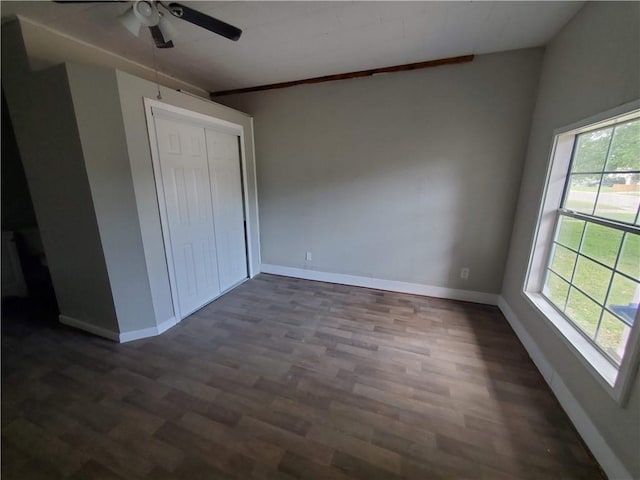 4413 N Cornelia Cir, Corpus Christi, TX 78408 - unfurnished bedroom featuring dark wood-style floors, baseboards, a closet, and ceiling fan
