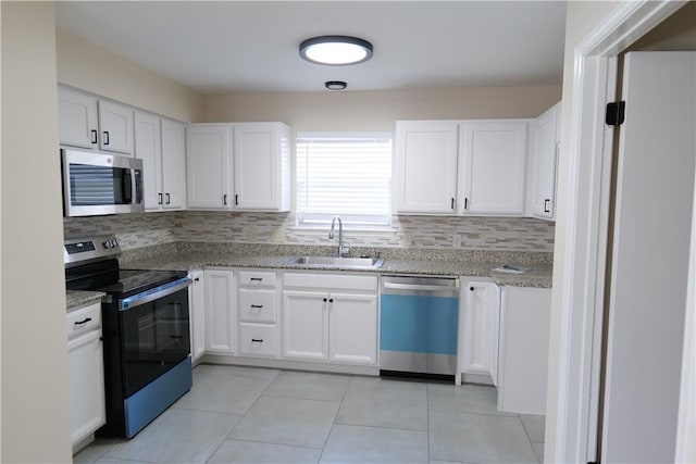 3022 Chapel Creek Dr, Corpus Christi, TX 78414 - kitchen featuring stainless steel appliances, decorative backsplash, light stone counters, and white cabinets
