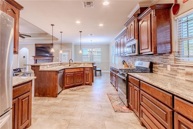 kitchen with visible vents, a ceiling fan, appliances with stainless steel finishes, and backsplash