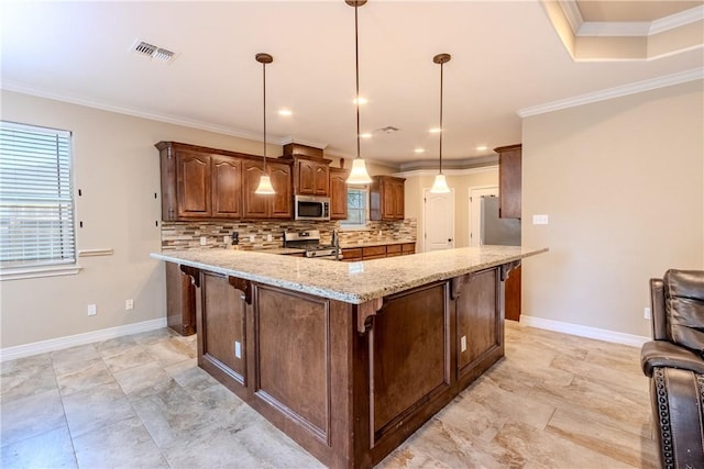 kitchen with visible vents, crown molding, appliances with stainless steel finishes, and backsplash