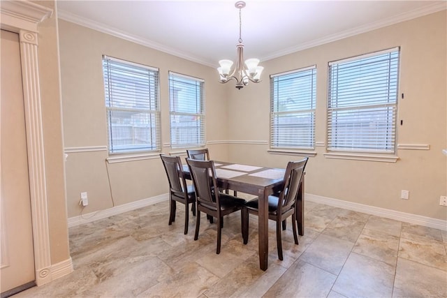 dining room featuring baseboards, an inviting chandelier, ornamental molding, and a healthy amount of sunlight