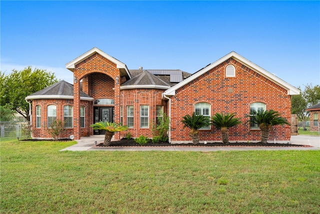 view of property with a front lawn