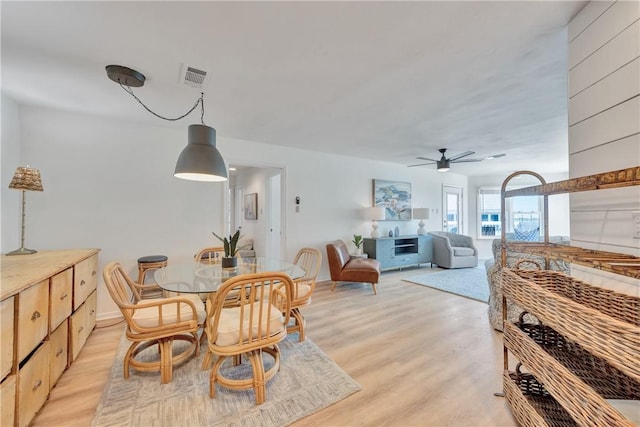 dining room featuring ceiling fan and light wood-type flooring