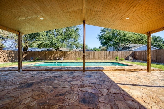 view of swimming pool with a patio