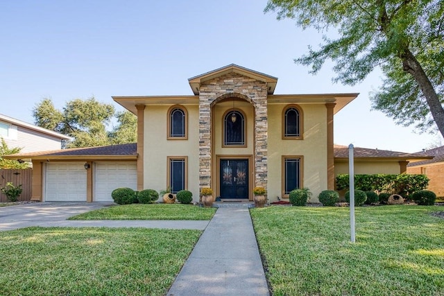 view of front of property with a front yard and a garage