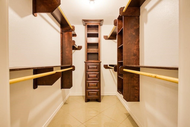 spacious closet featuring tile patterned flooring